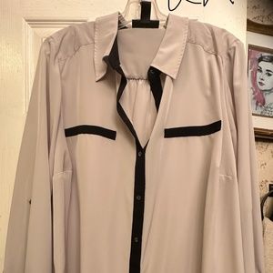 A silk like feel professional dressy top in black and khaki in color